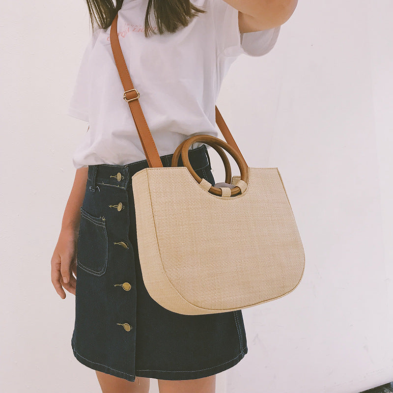 Straw handbag with wooden handle