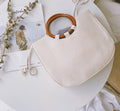 Straw handbag with wooden handle